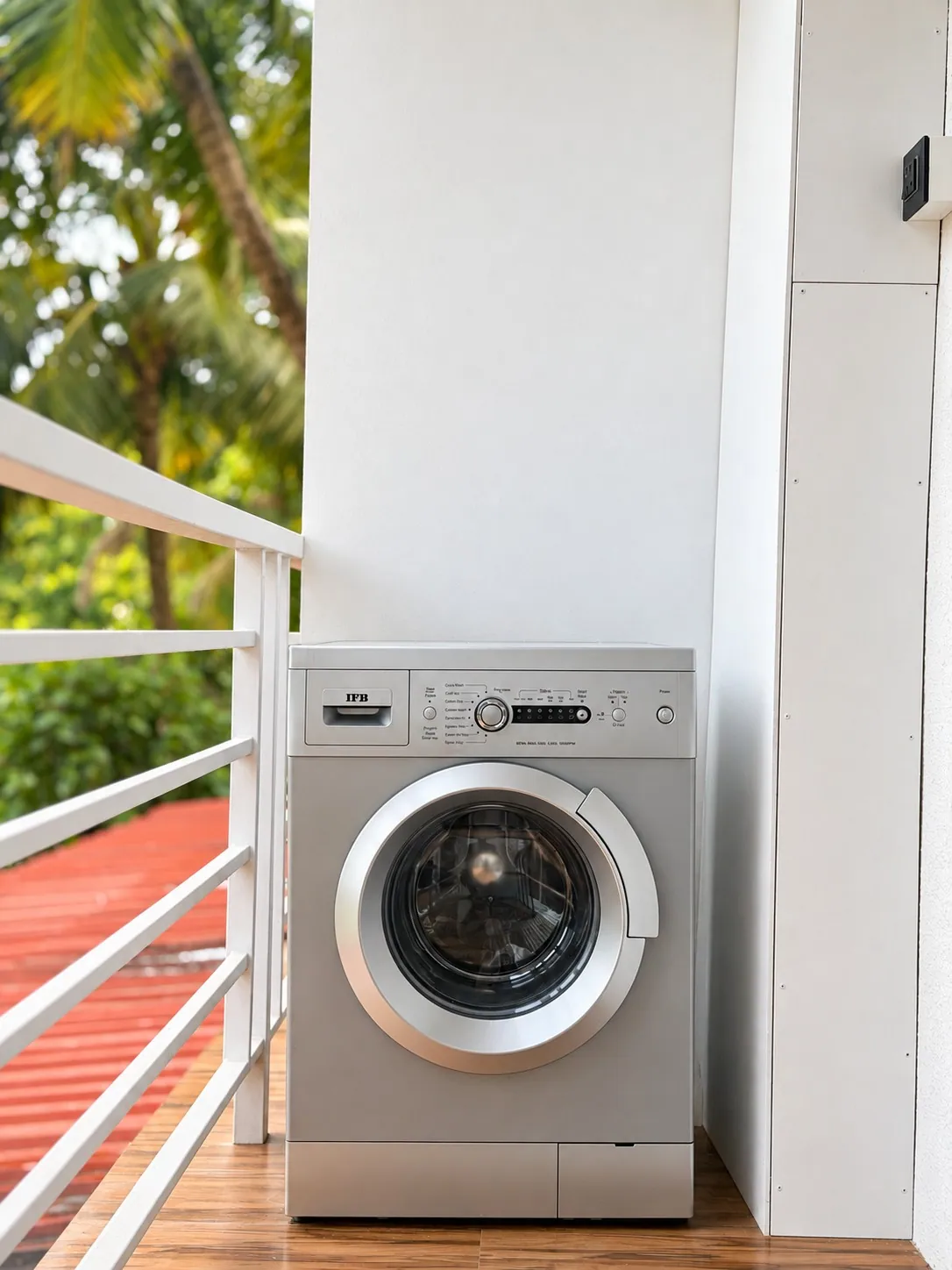 The fully automatic washing machine on the balcony