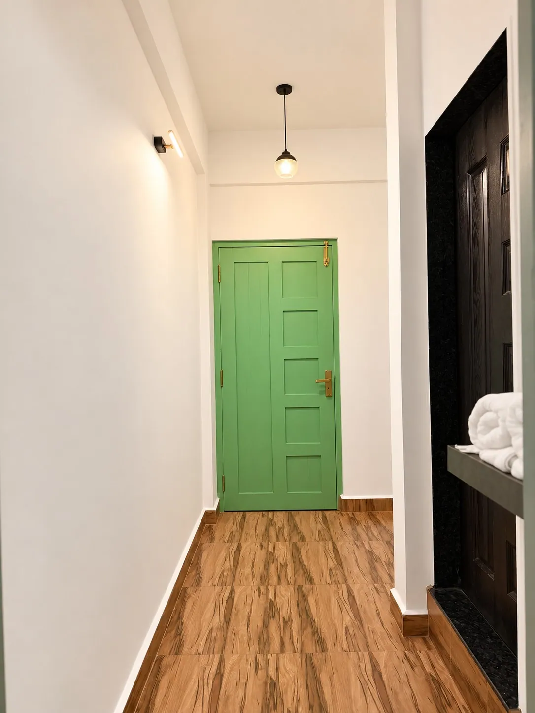 Looking back down the hallway to the green front door
