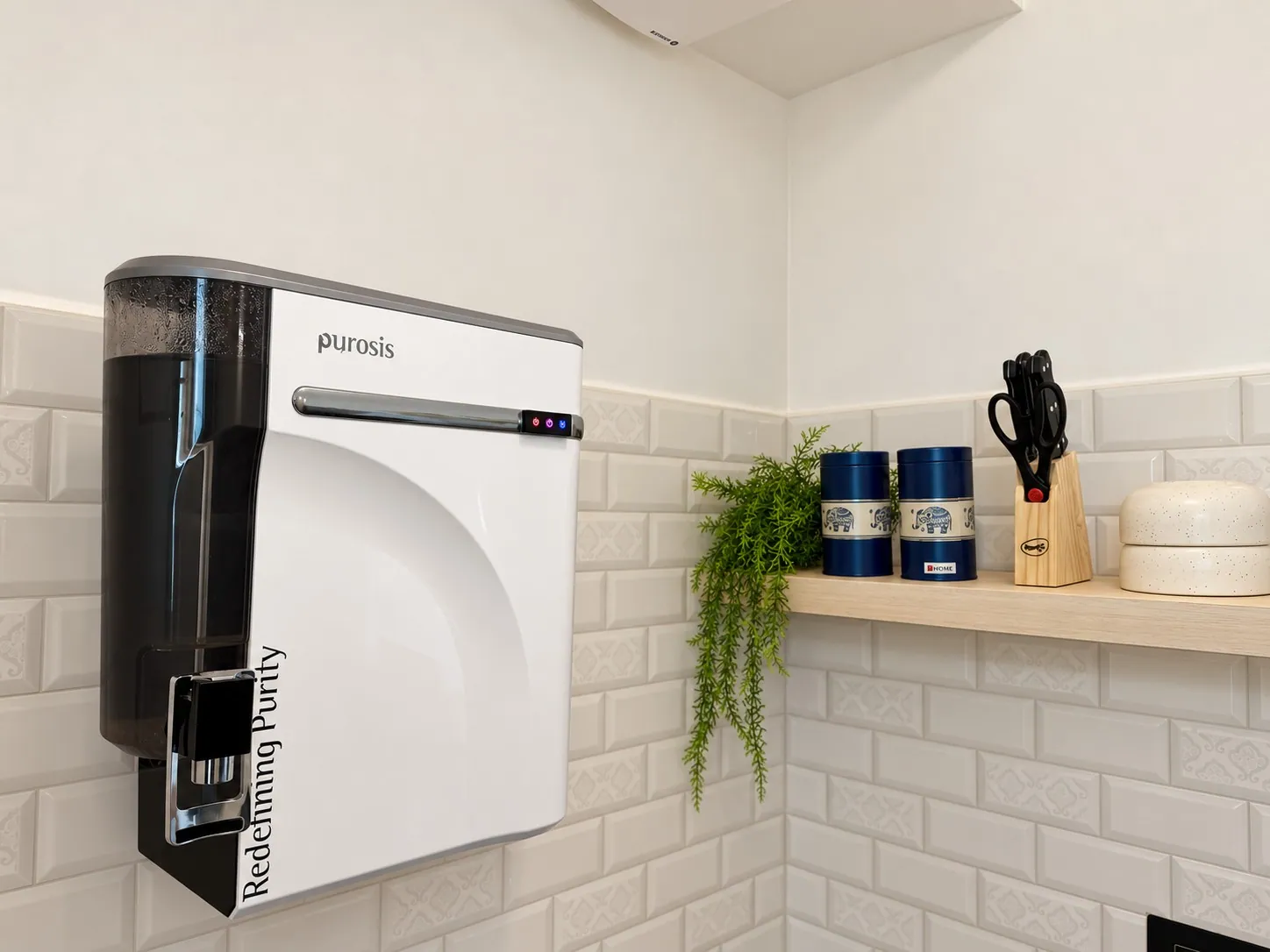 The RO drinking water purifier on the kitchen wall